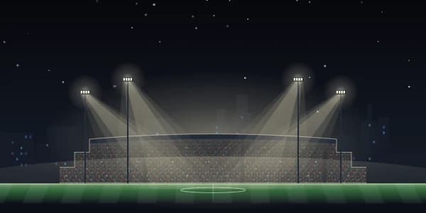 Floodlight: A stadium at night under the lights, full of camera flashes.